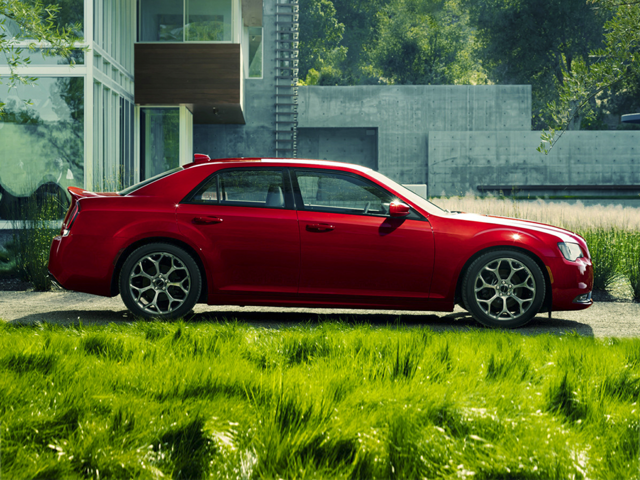 Side profile of a red 2023 Chrysler 300 Touring