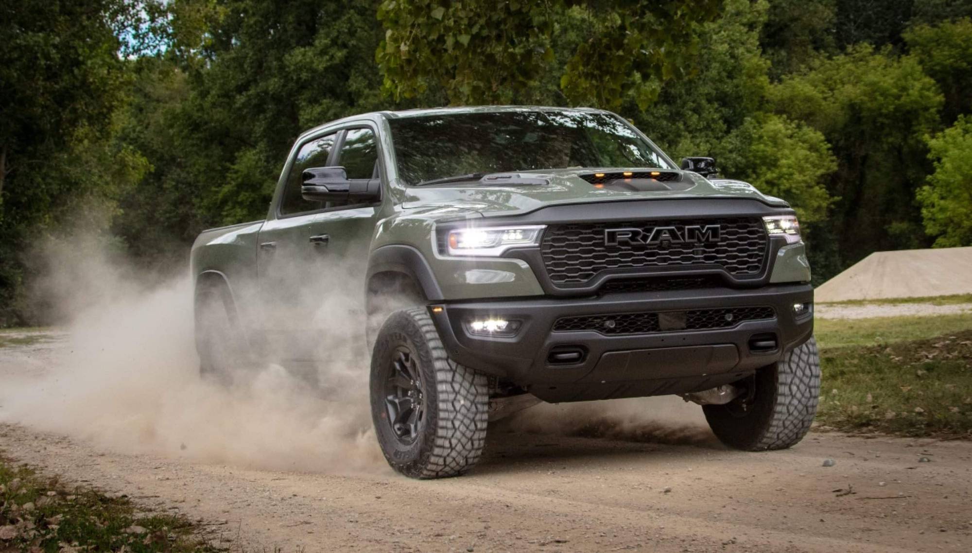 2026 Ram 1500 RHO kicking up dust on a dirt road near Bowie, TX